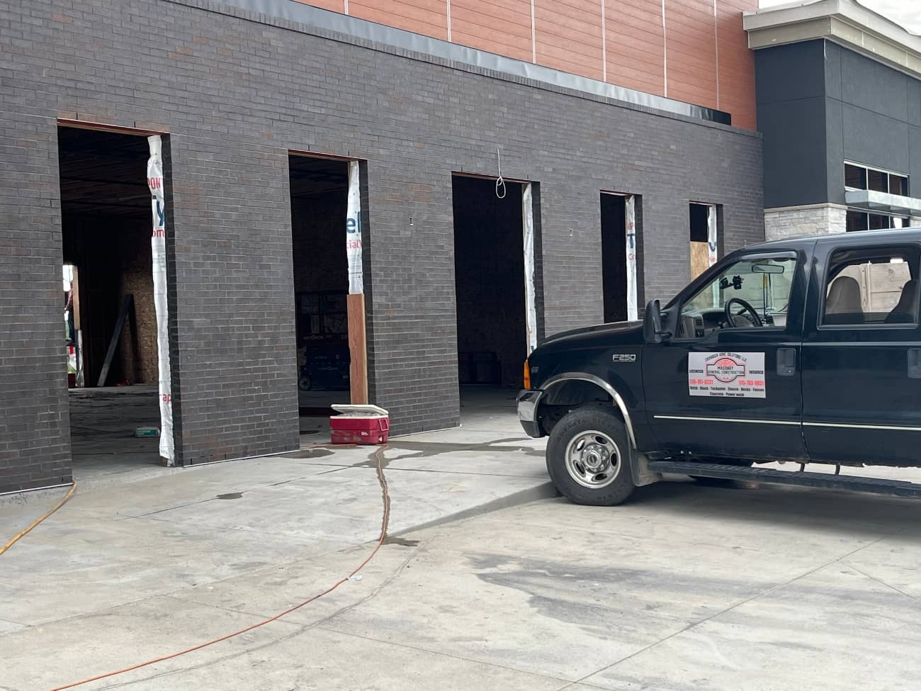 commercial masonry wall with truck on side